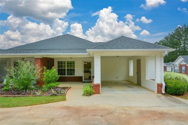 150 Old Mill Rd Unit 115, Cartersville, GA 30120 - view of front of house featuring driveway, a carport, roof with shingles, and brick siding