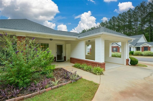 150 Old Mill Rd Unit 115, Cartersville, GA 30120 - doorway to property featuring concrete driveway, brick siding, and a shingled roof