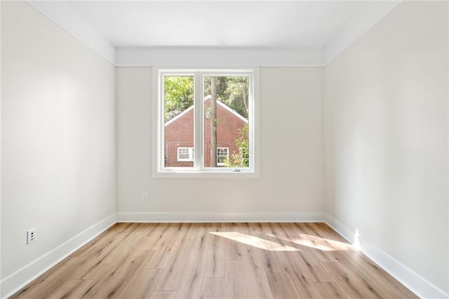 unfurnished room with light wood-type flooring