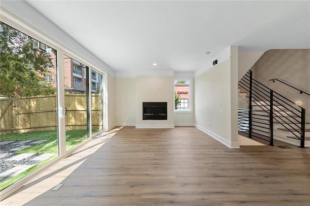 unfurnished living room with hardwood / wood-style floors