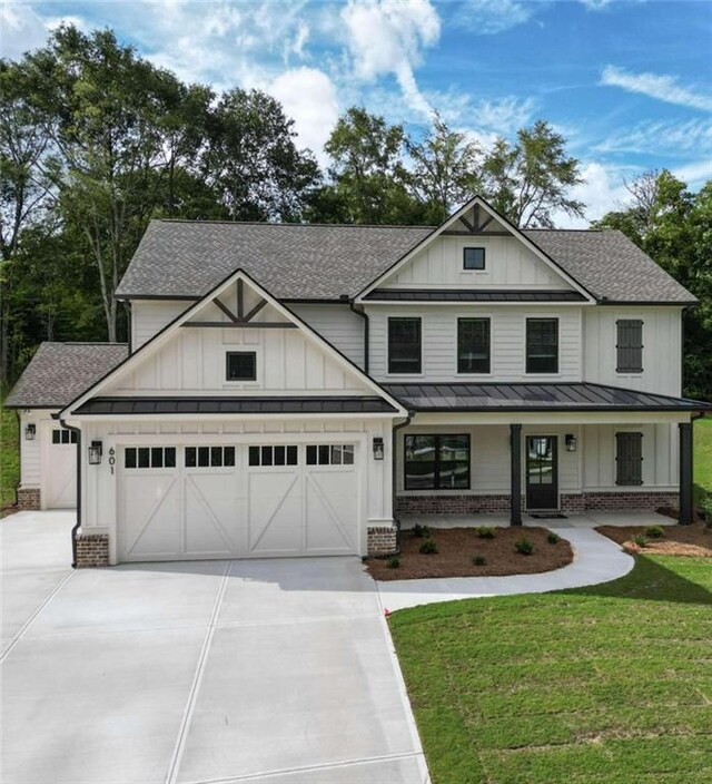 view of front facade with a garage and a front lawn