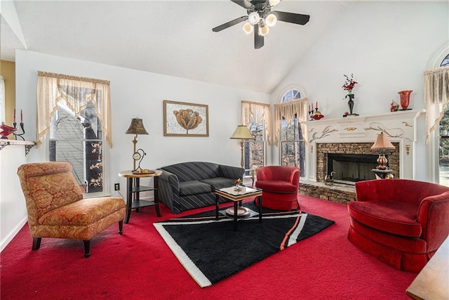 living area featuring a fireplace, high vaulted ceiling, a ceiling fan, and carpet floors