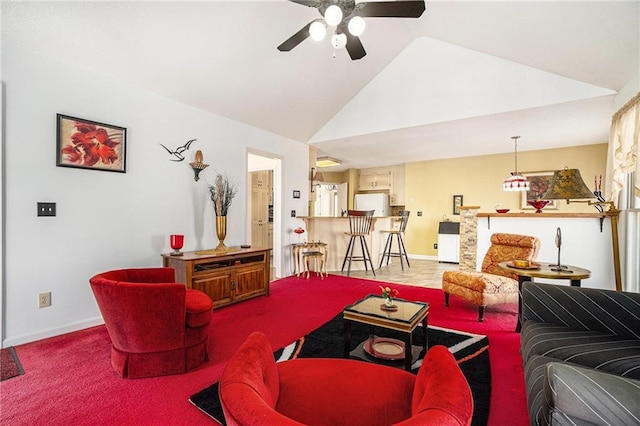 living room with a ceiling fan, baseboards, and high vaulted ceiling