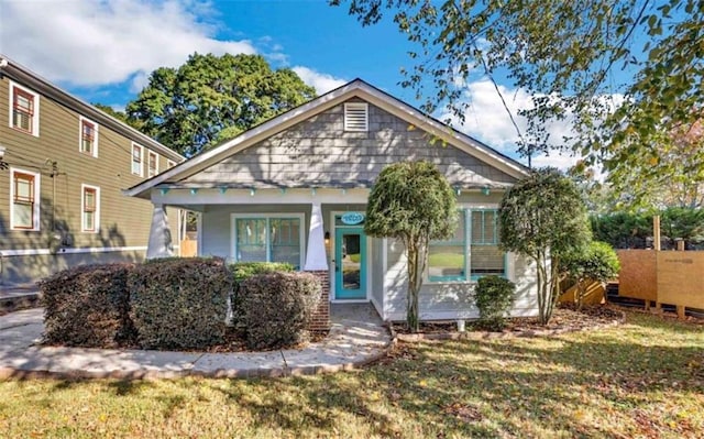 bungalow with a front lawn