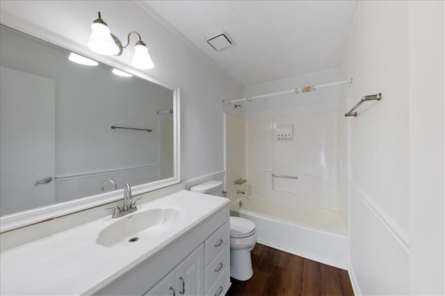 full bathroom with toilet,  shower combination, wood-type flooring, and vanity