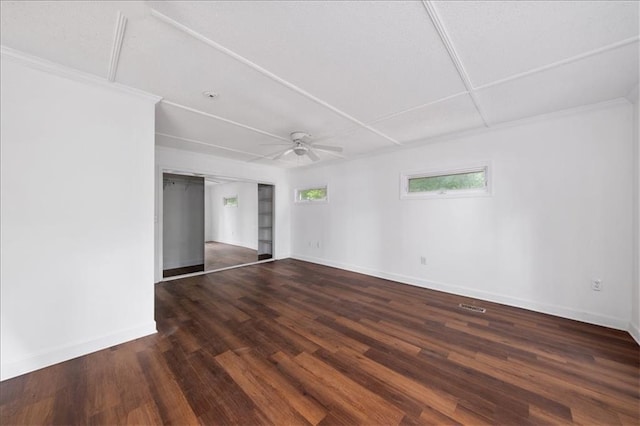 spare room with ceiling fan and dark hardwood / wood-style floors