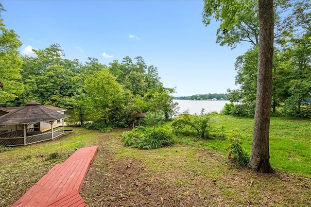 view of yard with a gazebo and a water view