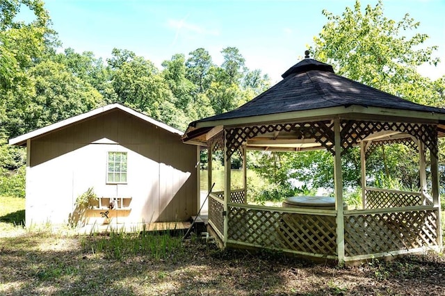 back of house featuring a gazebo