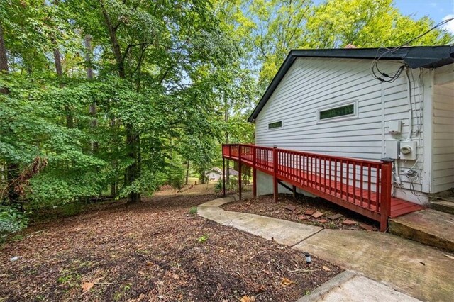 view of yard featuring a wooden deck