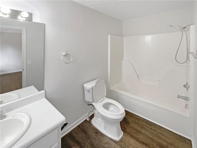 full bathroom with vanity, wood-type flooring, shower / washtub combination, and toilet