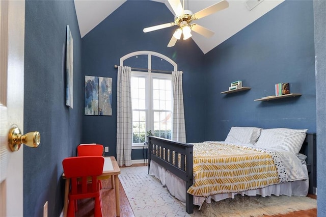 bedroom with lofted ceiling, wood finished floors, a ceiling fan, and baseboards