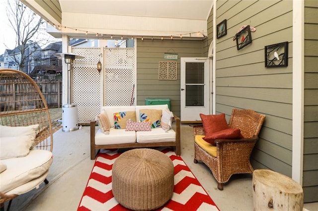 view of patio / terrace with outdoor lounge area and fence