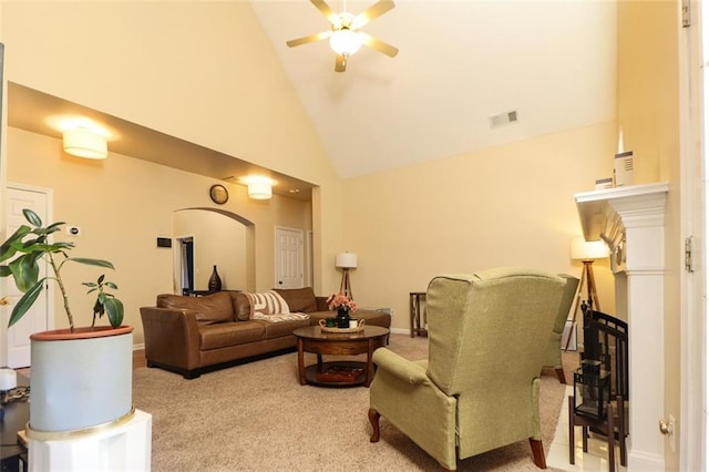 living room featuring carpet, visible vents, ceiling fan, high vaulted ceiling, and baseboards