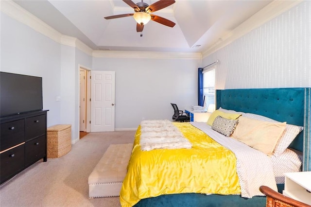 bedroom featuring crown molding, lofted ceiling, a raised ceiling, carpet flooring, and ceiling fan