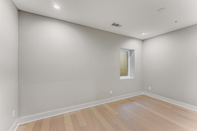 unfurnished room with light hardwood / wood-style flooring