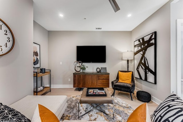 living room with light hardwood / wood-style flooring