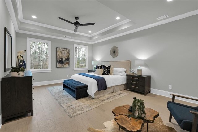 bathroom featuring visible vents, crown molding, a freestanding tub, a shower stall, and a sink