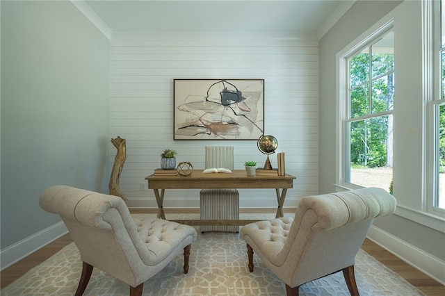 home office with ornamental molding, radiator, baseboards, and wood finished floors