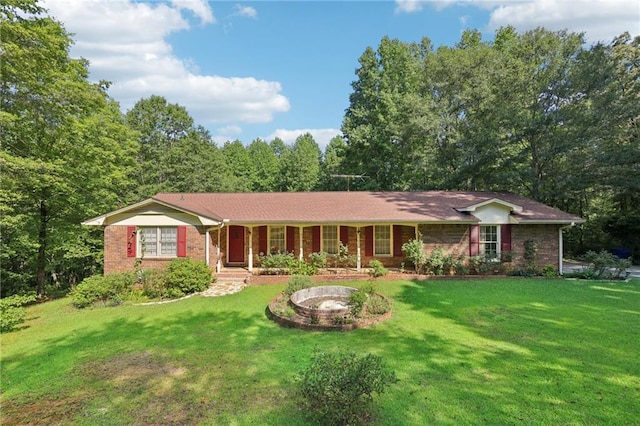 ranch-style house featuring a front yard and a porch