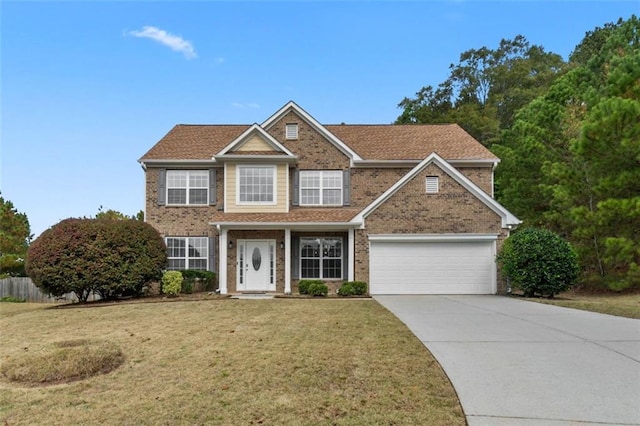 view of front of house with a garage and a front lawn