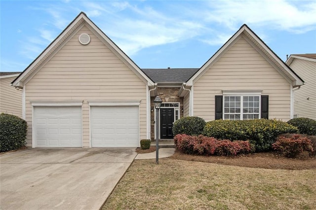 single story home with a garage, concrete driveway, and stone siding