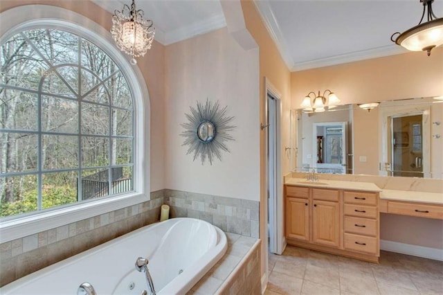 full bath featuring a chandelier, vanity, crown molding, and a whirlpool tub