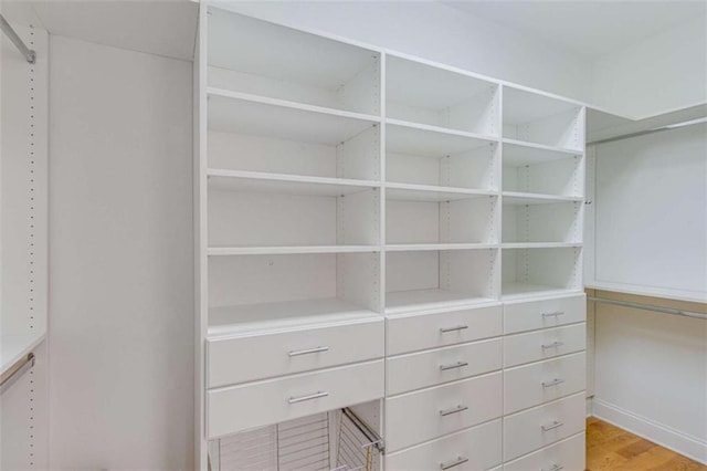 spacious closet with wood finished floors