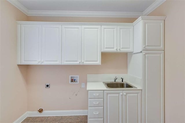 laundry room featuring baseboards, hookup for a washing machine, cabinet space, electric dryer hookup, and a sink