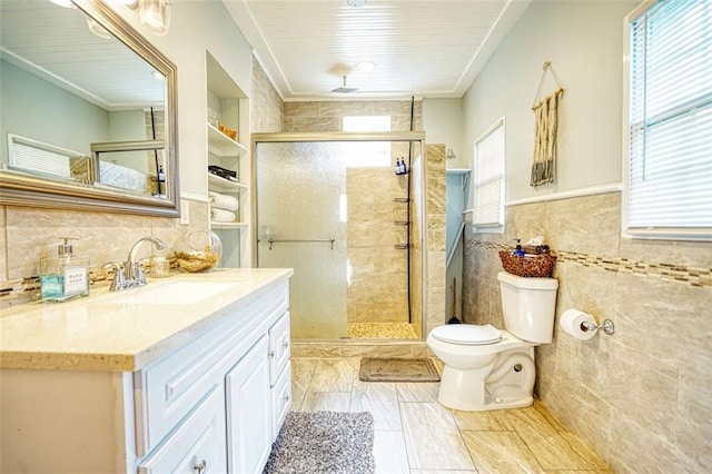 full bath featuring toilet, a shower stall, tile walls, and vanity