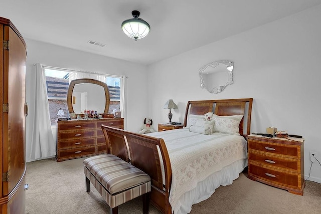 bedroom featuring light colored carpet