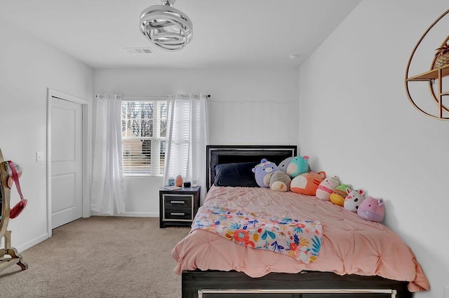 bedroom featuring light colored carpet