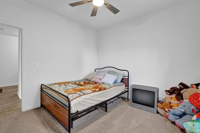 carpeted bedroom featuring ceiling fan