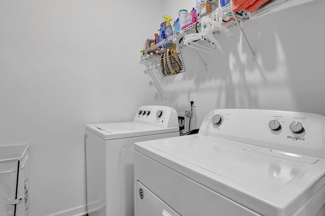 clothes washing area featuring washing machine and clothes dryer