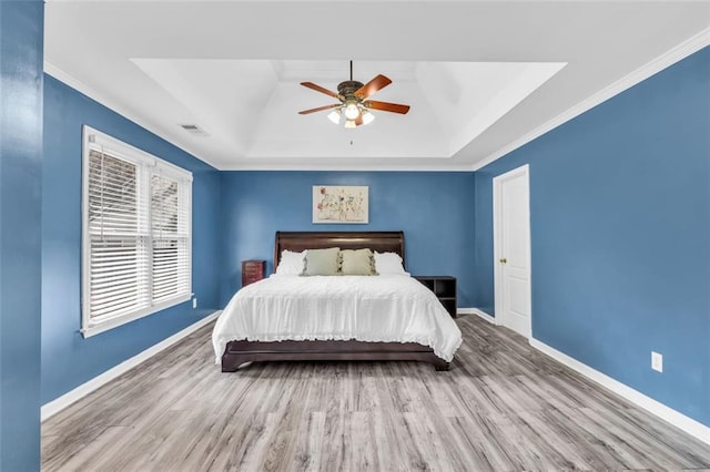 947 Summer Forest Dr, Suwanee, GA 30024 - bedroom with a raised ceiling, wood finished floors, baseboards, ornamental molding, and ceiling fan