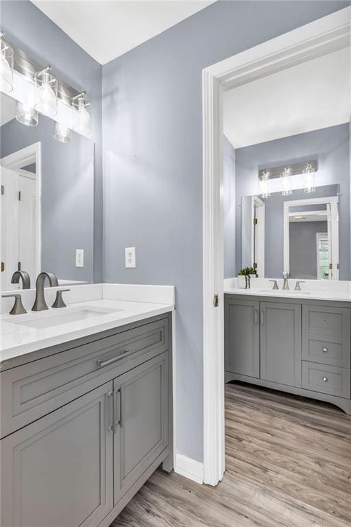 947 Summer Forest Dr, Suwanee, GA 30024 - full bathroom featuring vanity, wood finished floors, and baseboards