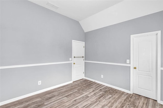 947 Summer Forest Dr, Suwanee, GA 30024 - spare room featuring wood finished floors, lofted ceiling, and baseboards