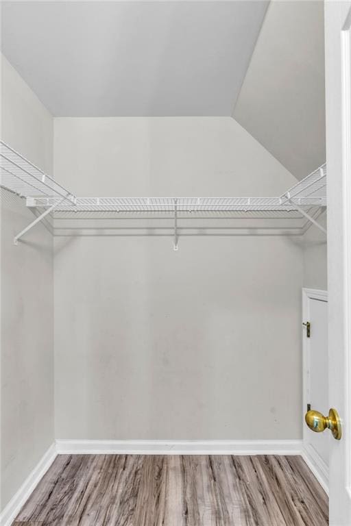 947 Summer Forest Dr, Suwanee, GA 30024 - walk in closet with wood finished floors
