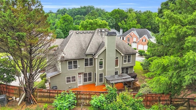 947 Summer Forest Dr, Suwanee, GA 30024 - back of property featuring a chimney, a fenced backyard, and a wooden deck