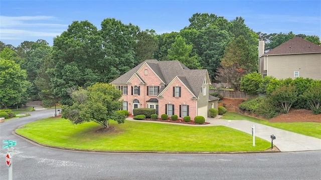 947 Summer Forest Dr, Suwanee, GA 30024 - colonial-style house with concrete driveway, a garage, and a front yard