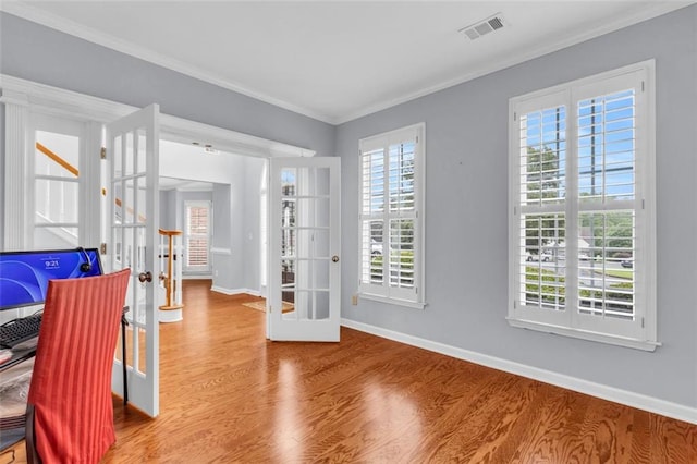 947 Summer Forest Dr, Suwanee, GA 30024 - office area featuring wood finished floors, ornamental molding, healthy amount of natural light, baseboards, and french doors
