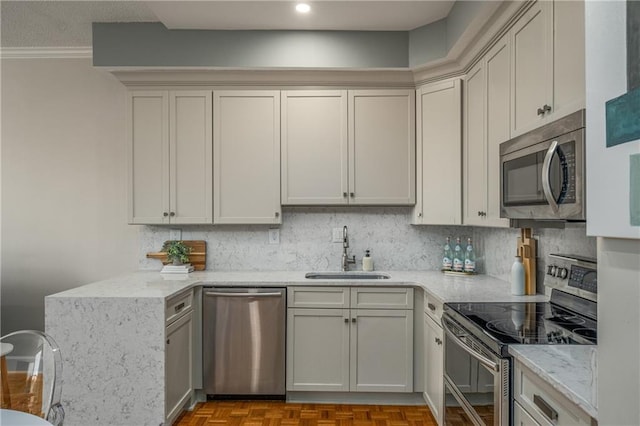 130 26th St NW Unit 415, Atlanta, GA 30309 - kitchen featuring stainless steel appliances, ornamental molding, backsplash, light stone countertops, and recessed lighting