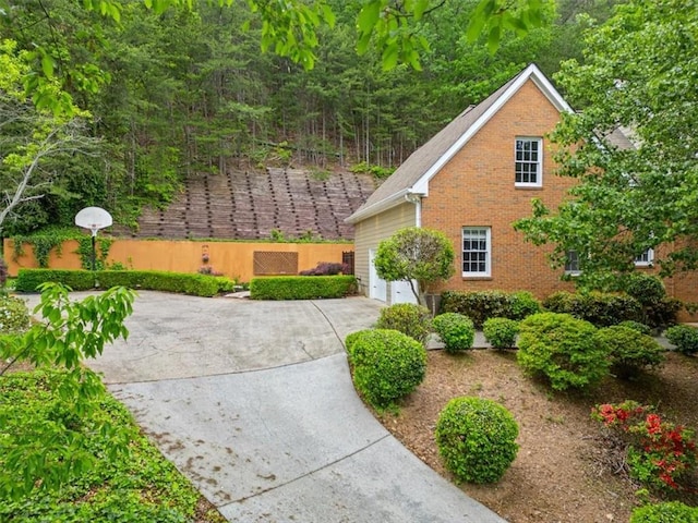 4515 N Slope Cir, Marietta, GA 30066 - view of side of home featuring driveway and brick siding