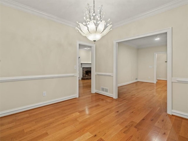 4515 N Slope Cir, Marietta, GA 30066 - unfurnished dining area with a chandelier, crown molding, visible vents, baseboards, and hardwood / wood-style flooring