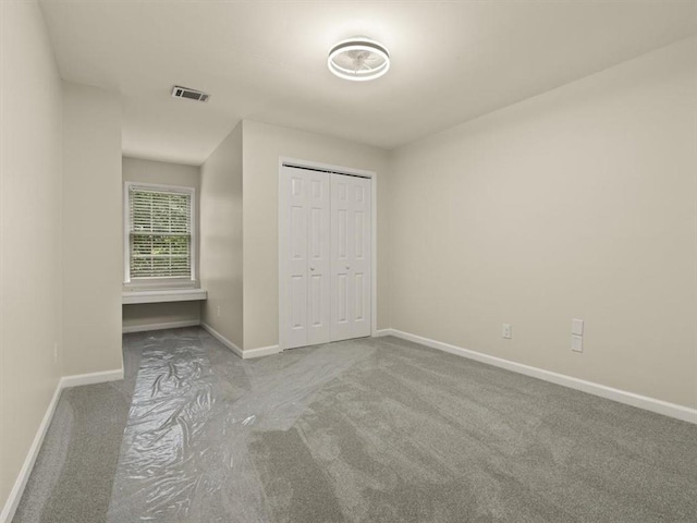4515 N Slope Cir, Marietta, GA 30066 - unfurnished bedroom with visible vents, a closet, baseboards, and carpet floors