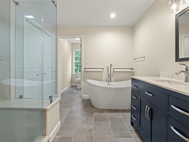 4515 N Slope Cir, Marietta, GA 30066 - full bath featuring a stall shower, toilet, tile patterned floors, vanity, and a freestanding bath