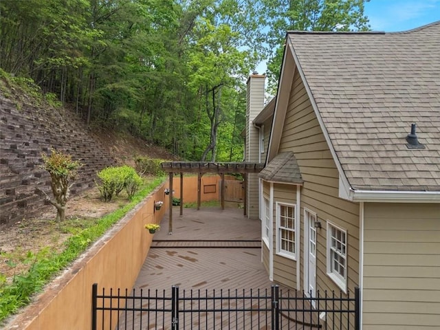 4515 N Slope Cir, Marietta, GA 30066 - view of side of home featuring a pergola, a chimney, a deck, roof with shingles, and fence