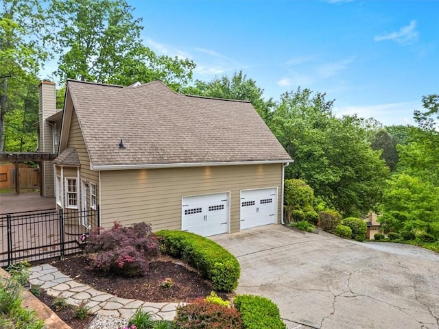 4515 N Slope Cir, Marietta, GA 30066 - view of side of home featuring fence, roof with shingles, and a chimney