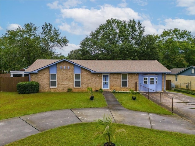 ranch-style home featuring a front yard