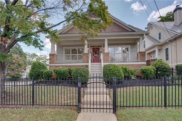 view of front of home featuring a porch and a front yard