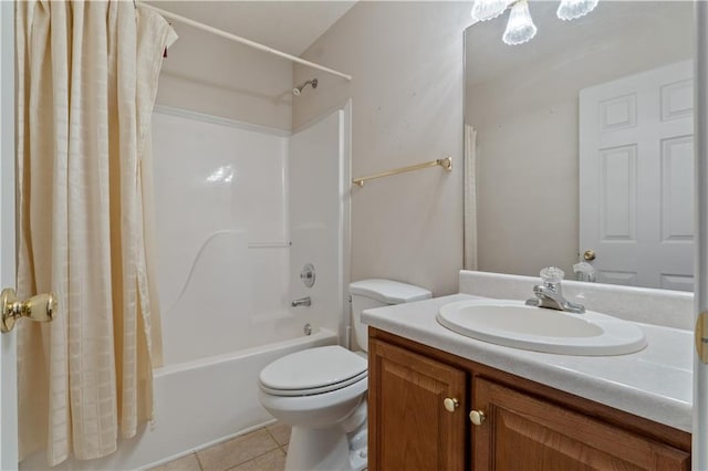 full bathroom with shower / tub combo with curtain, vanity, toilet, and tile patterned floors
